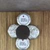 A close up of a bottle cap on a table