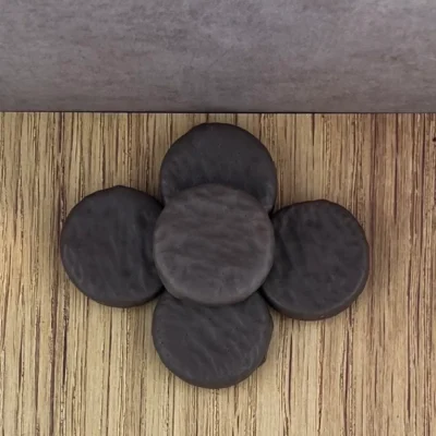 A wooden floor with some black coins on it